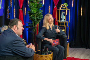 Denise Sobiewski hosting The Superstar Denise Show in the studio during a celebrity talk show interview.